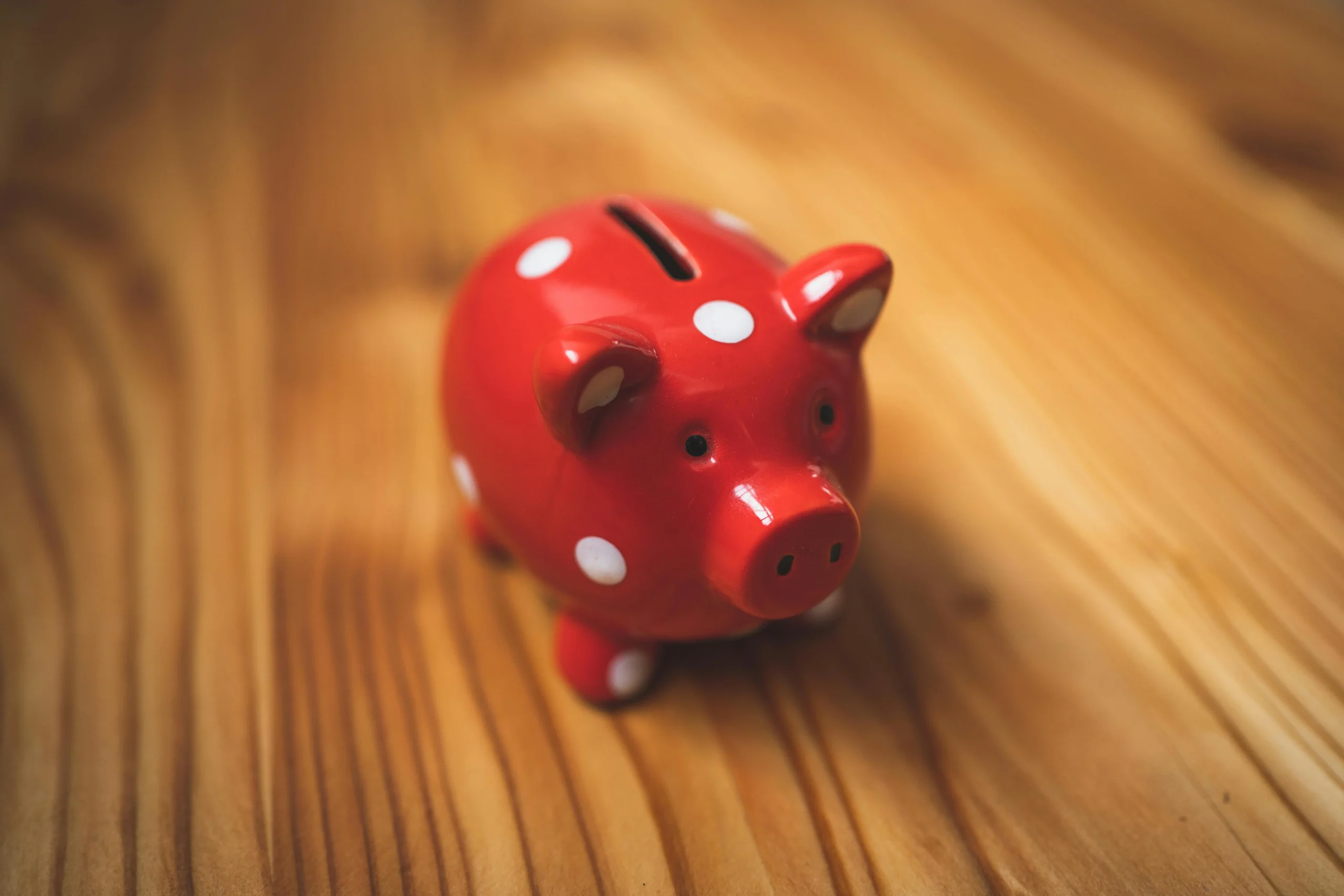 529 to Roth IRA rollover 2026: Ultimate Guide for Families 2 529 to Roth IRA rollover 2026: Close-up of a red polka dot piggy bank on a wooden surface, symbolizing savings