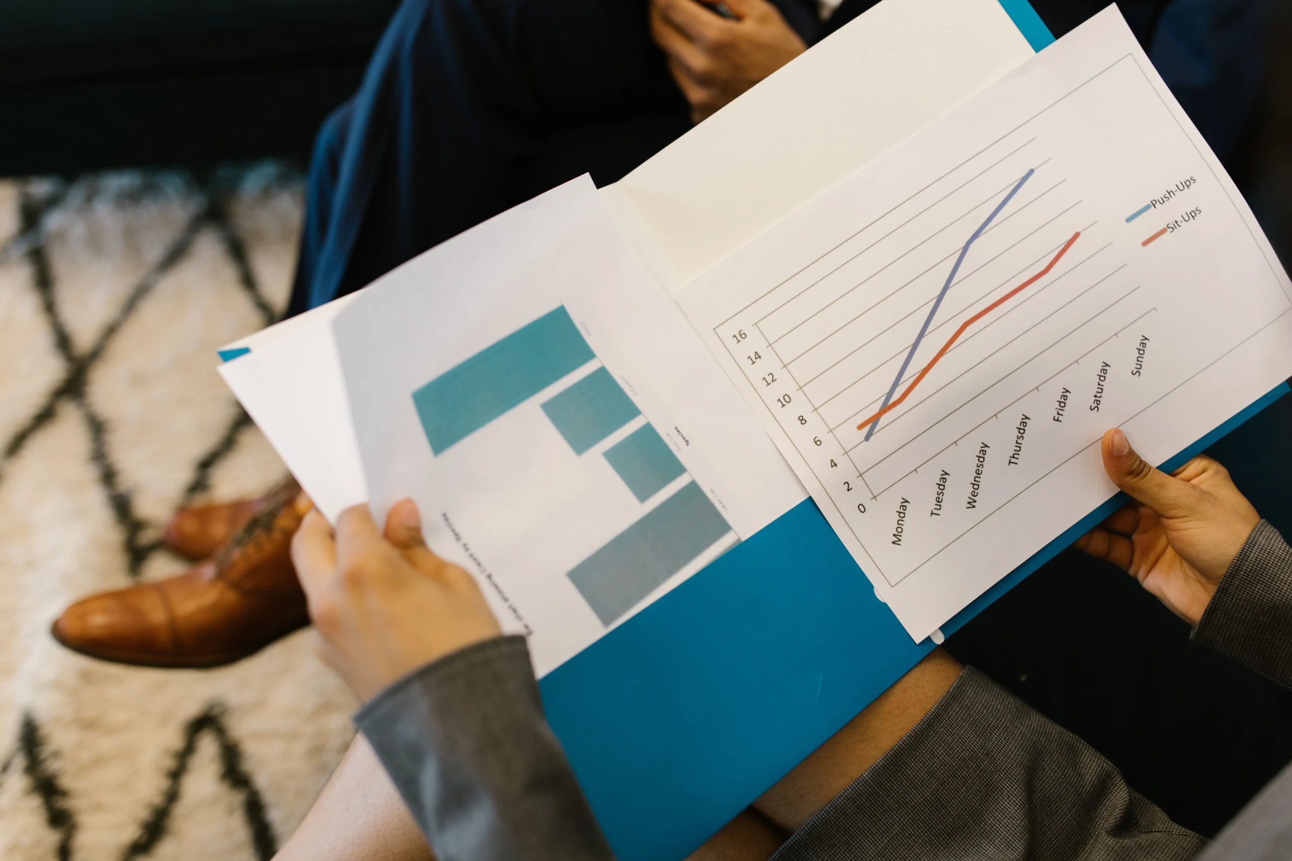credit card utilization strategy 2026: Detailed view of business reports with graphs during a corporate meeting