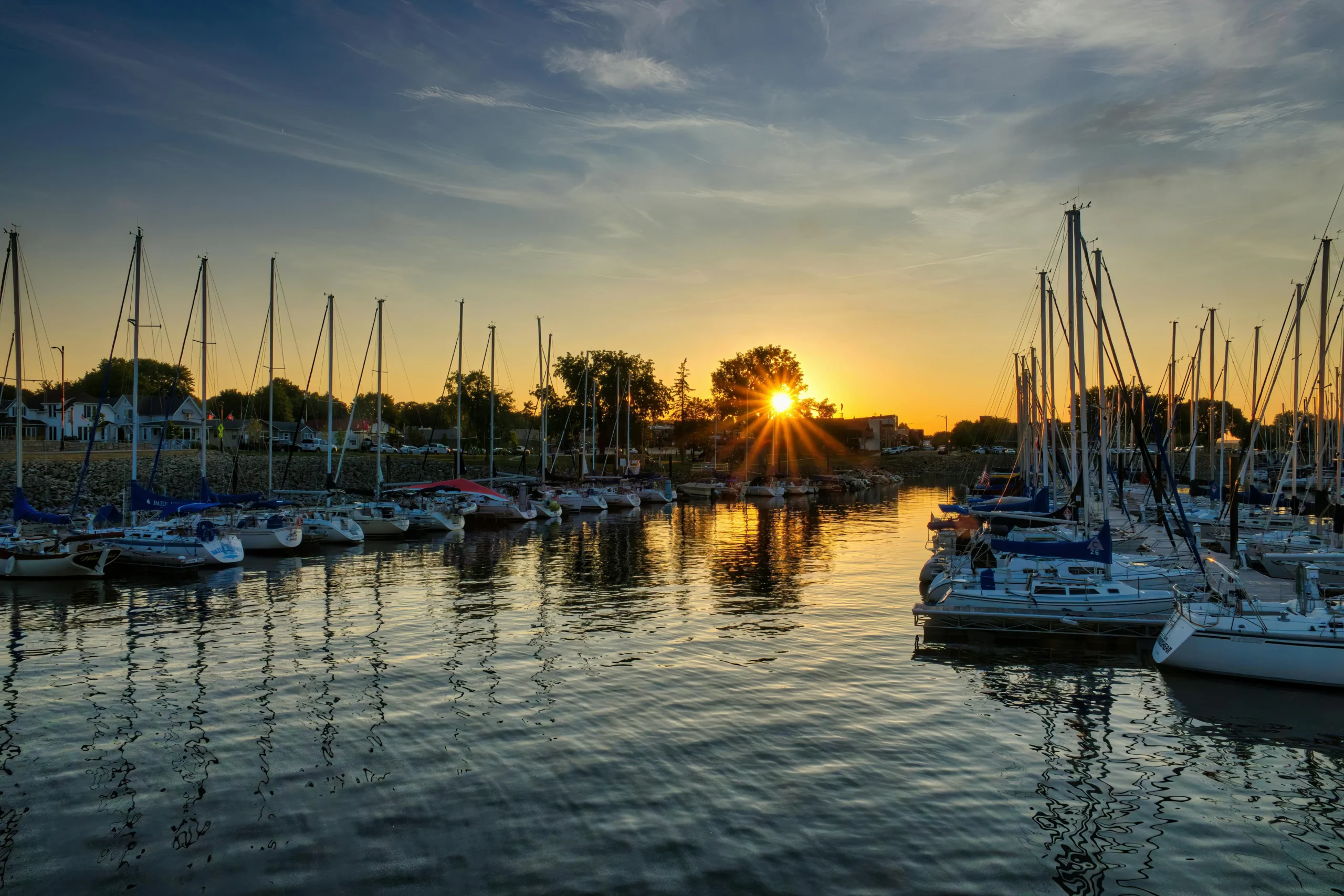 Emergency Fund Size 2026: Ultimate 3-6-12 Guide Proven 1 emergency fund size 2026: Sailboats docked at a marina during a peaceful sunset with calm water reflection