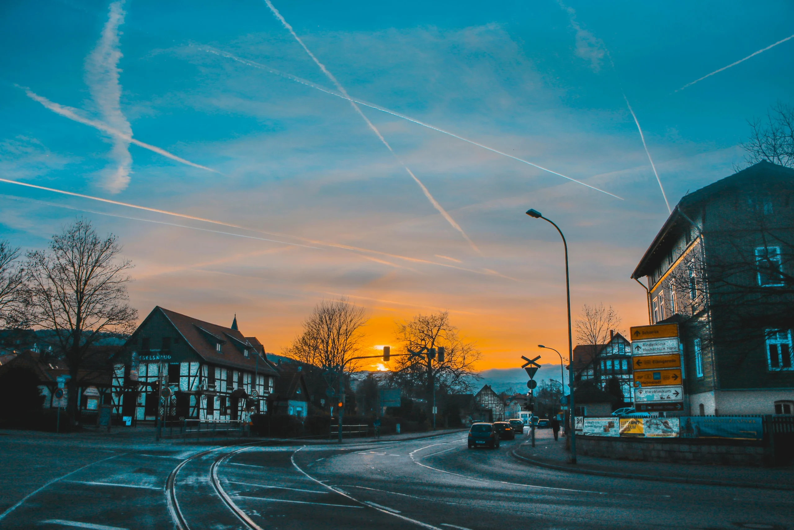 traditional vs Roth 401k 2026: Picturesque sunset view over a street in Wernigerode, Germany with half-timbered houses and a