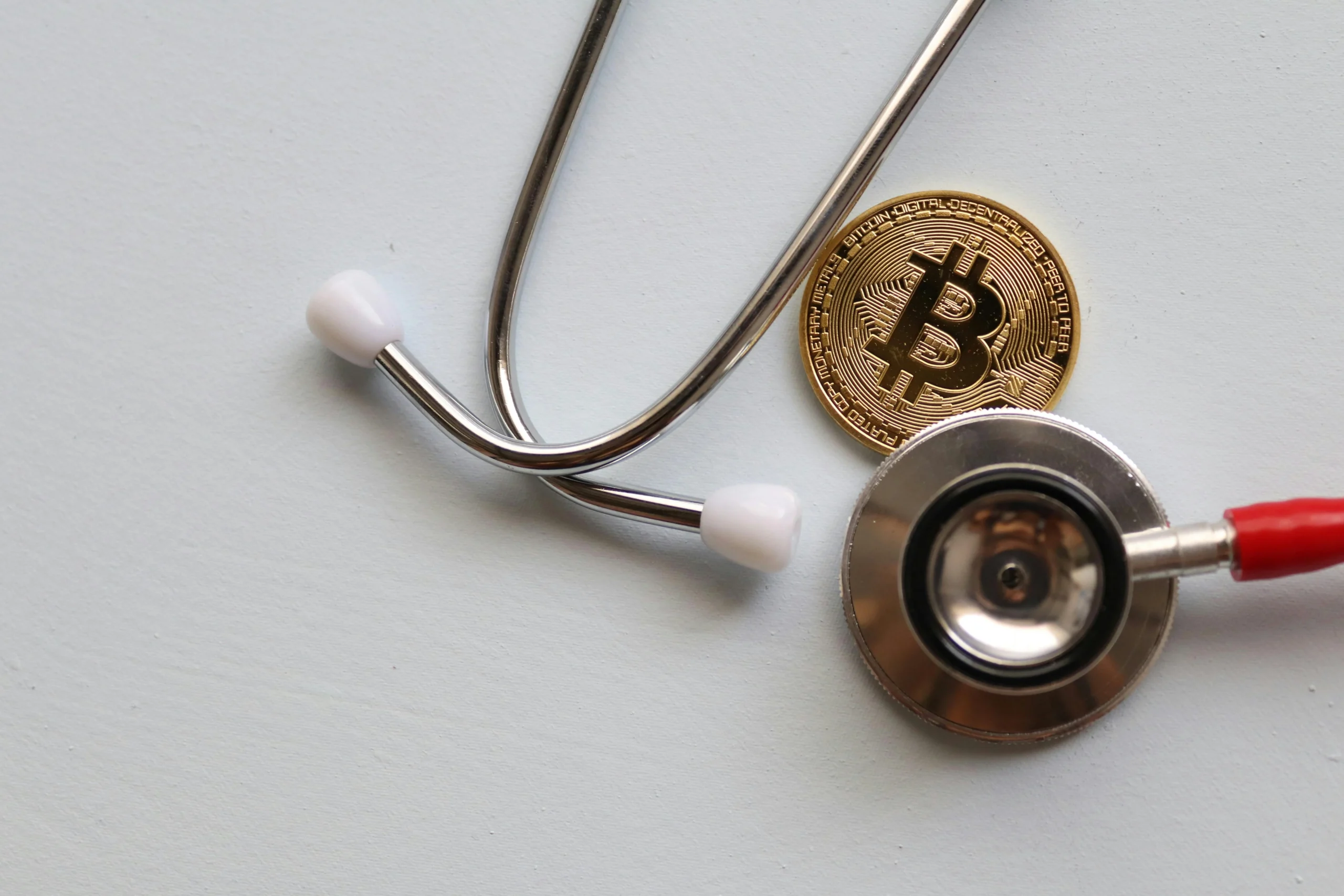 HSA Investment Strategy 2026: Ultimate Guide - Proven Plan 2 HSA investment strategy 2026: A stethoscope with a Bitcoin coin symbolizing the intersection of healthcare and cryptocurrency