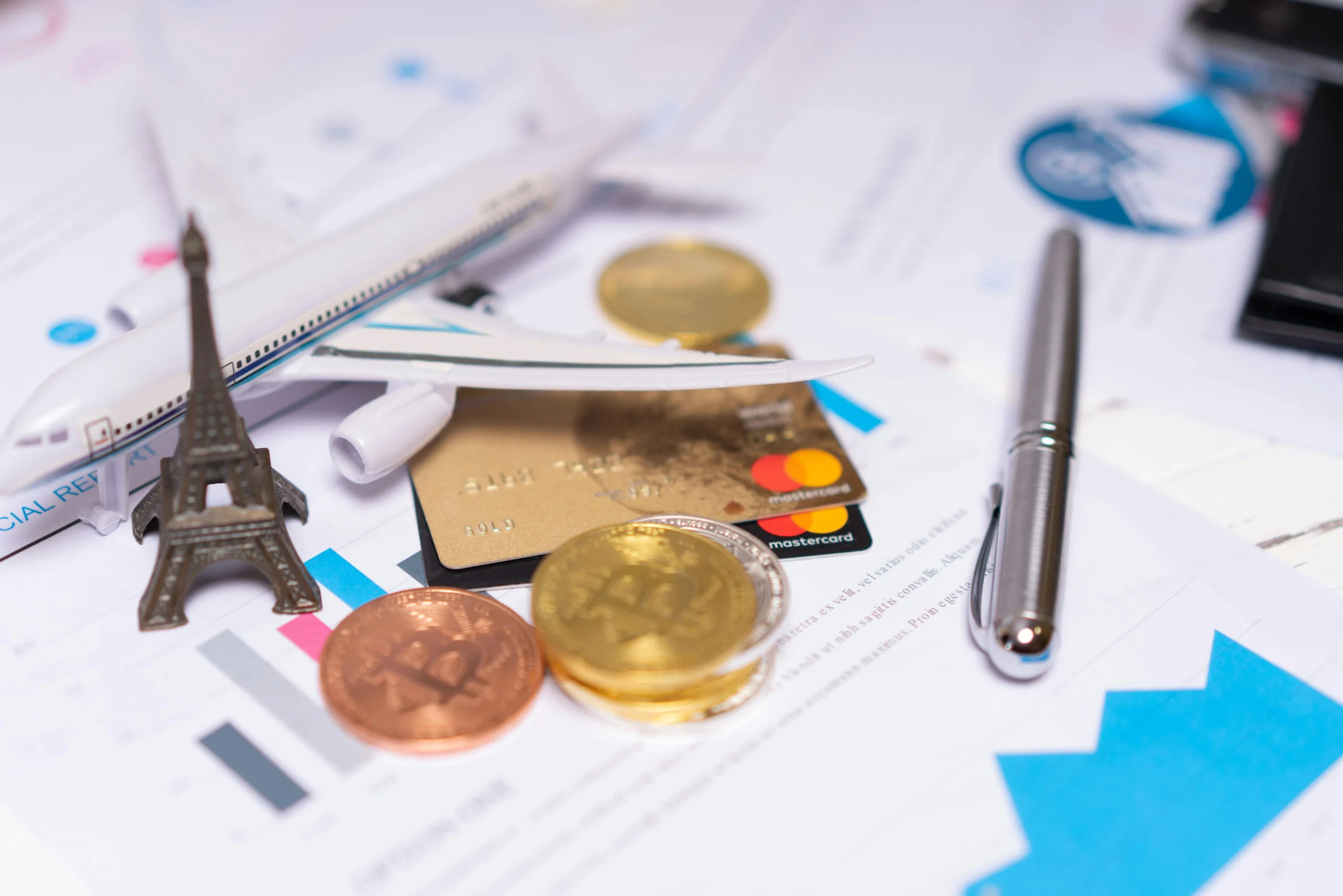 Multicurrency Account for Business: A Practical, ROI-First Guide for U.S. Companies 2 Multicurrency account — A travel finance concept featuring cryptocurrency, credit card, airplane model, and Eiffel Tower on financial documents.