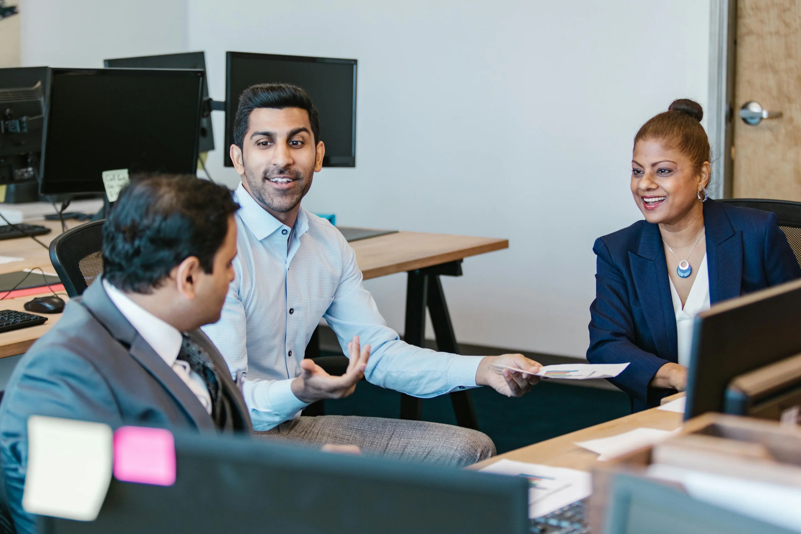 Small Business Health Insurance 2026: 3 Ultimate Options 3 small business health insurance 2026: Colleagues engaging in a productive discussion in a modern office setting