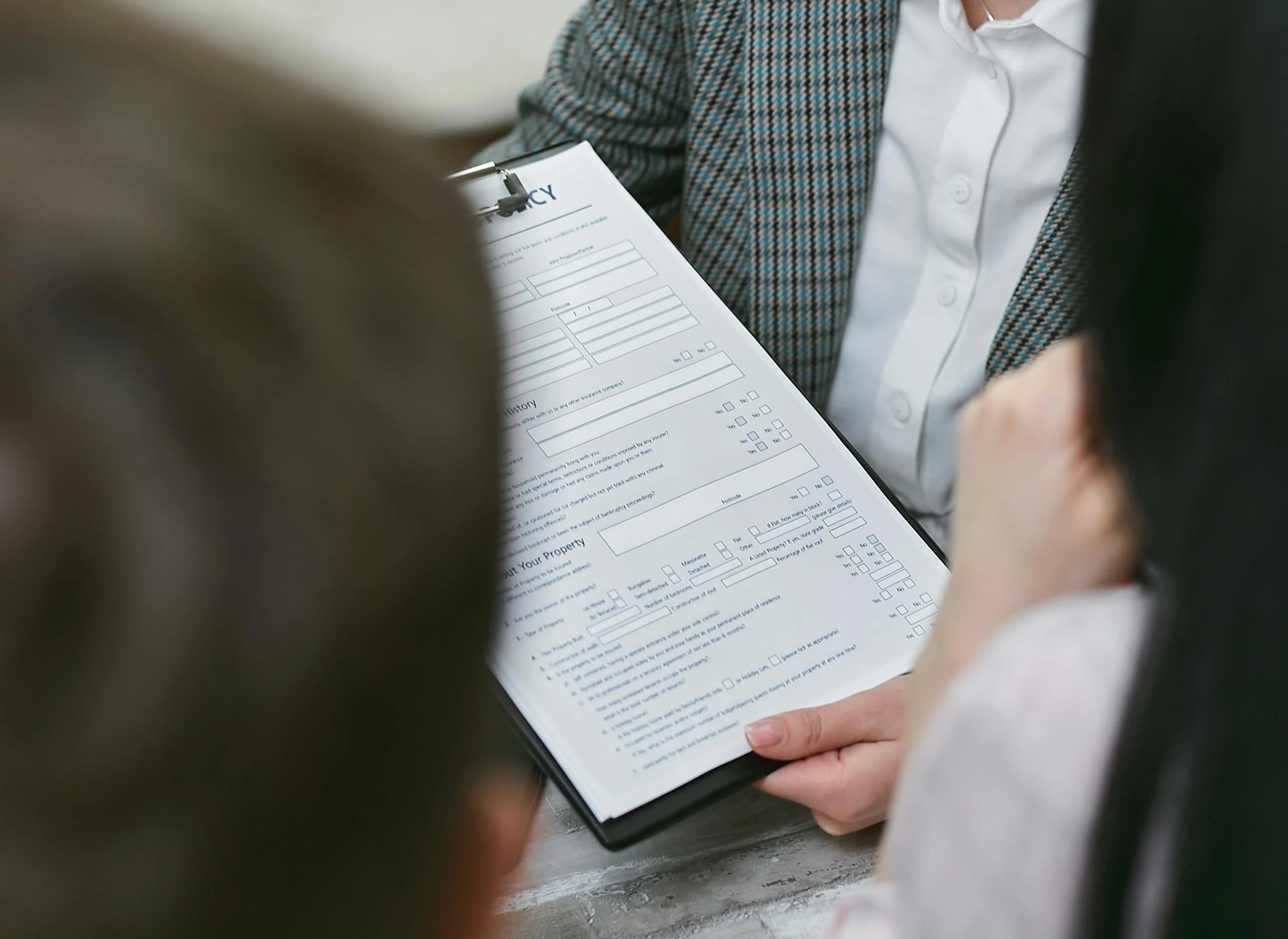 Term vs Whole Life Insurance 2026: The Ultimate Cost Guide 2 term vs whole life insurance 2026: Close-up of professionals discussing a legal contract during a business meeting