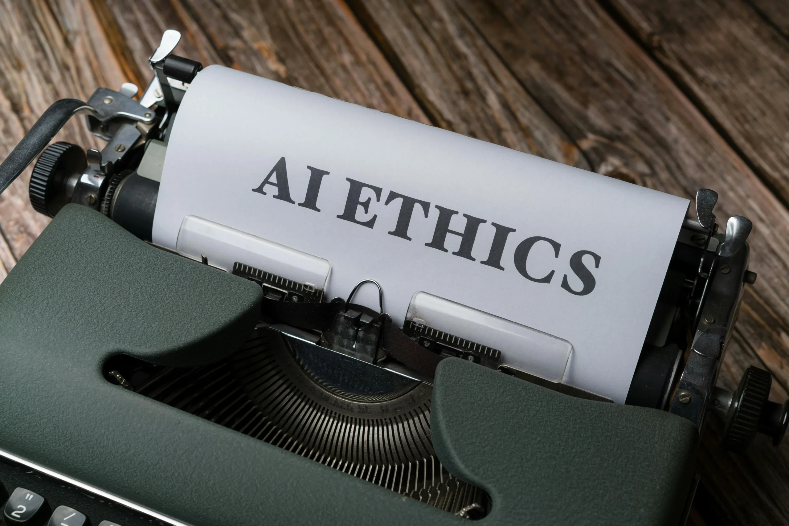 Tilt cash advances — Retro typewriter with 'AI Ethics' on paper, conveying technology themes.