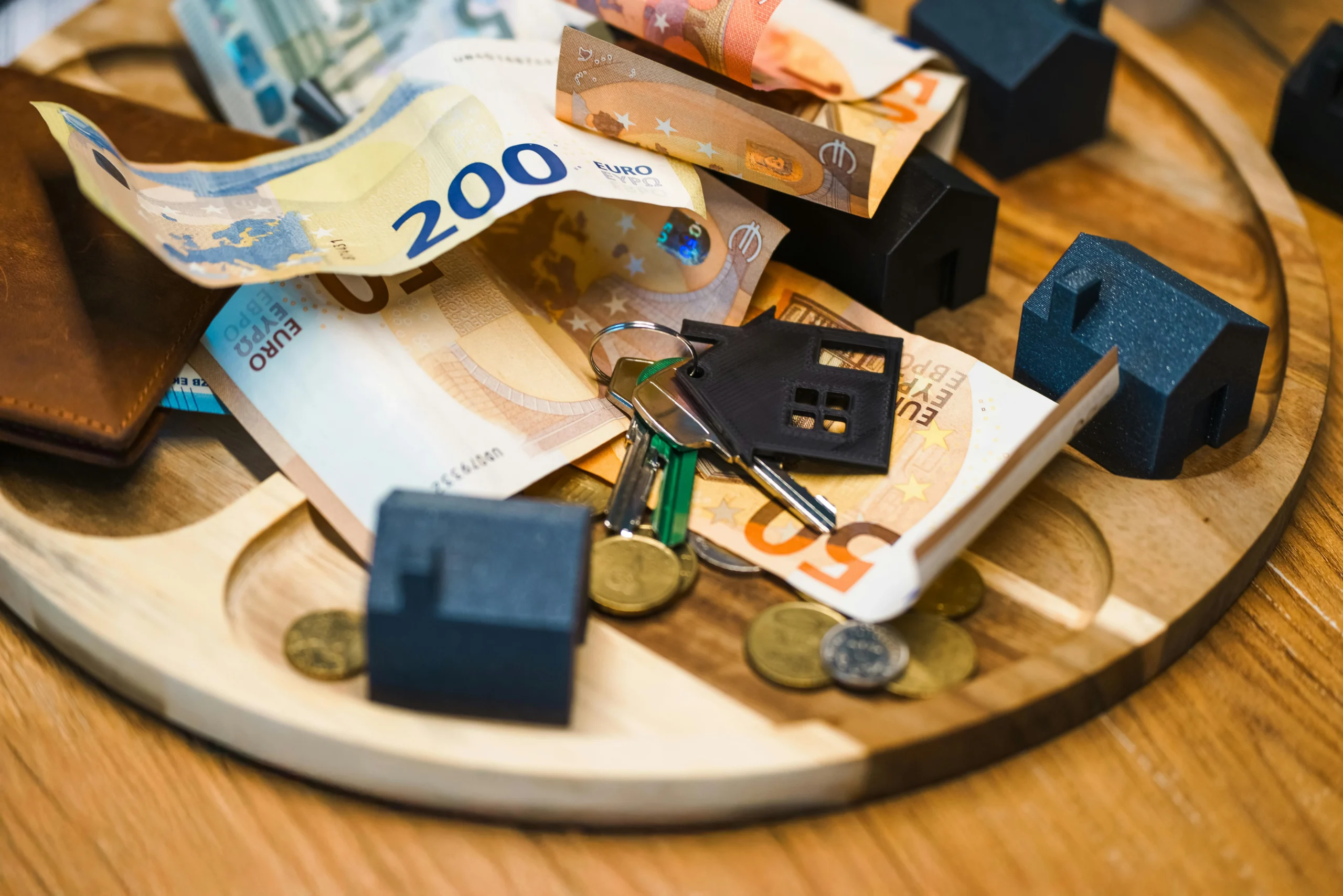 Umbrella Insurance 2026: Ultimate Guide to Protect $Millions 3 umbrella insurance 2026: Euro currency, keys, and miniature houses symbolize real estate and finance concepts